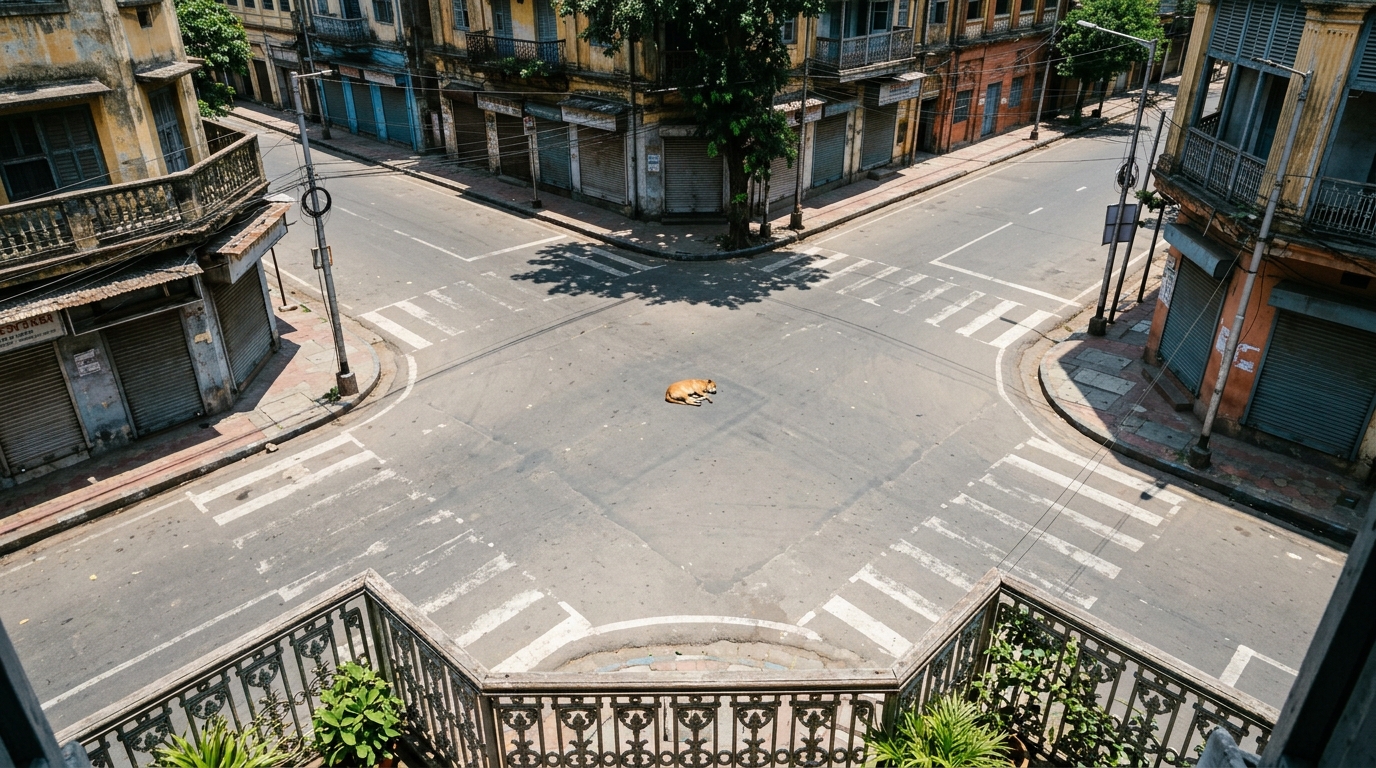 High angle view of a completely deserted Indian city intersection seen from a balcony.